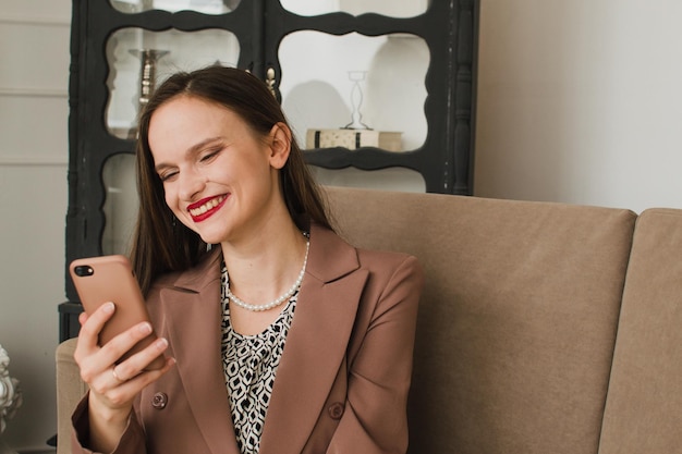 Woman looking at phone and smiling