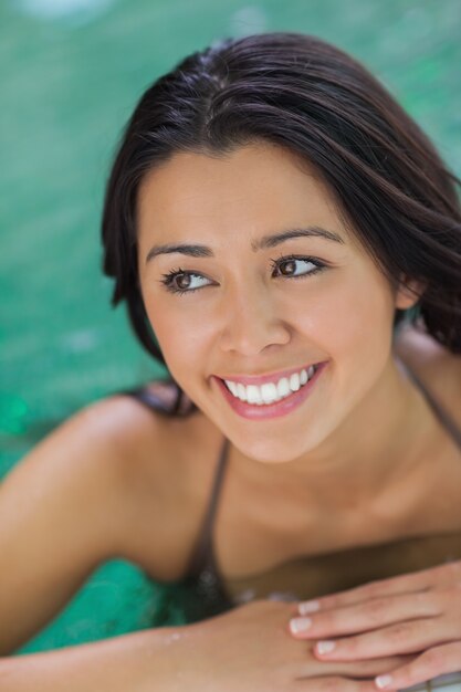 Woman looking up from pool