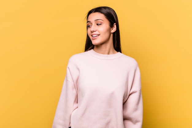 woman looks aside smiling cheerful and pleasant