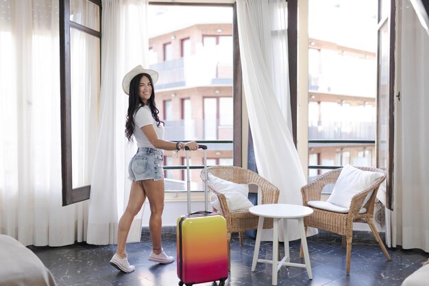 Woman looks out a hotel window