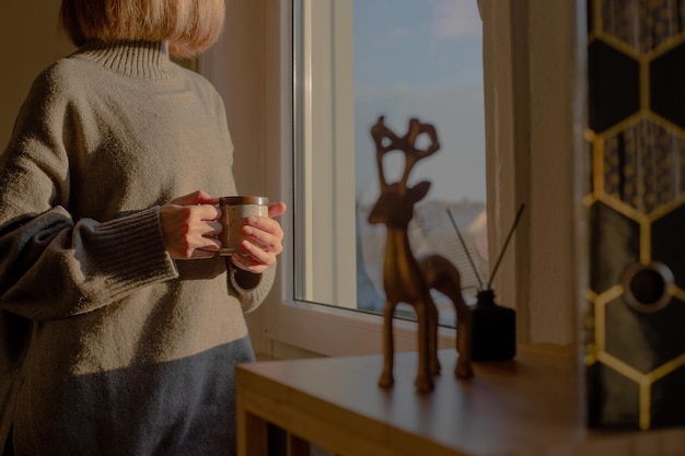 Woman looks thoughtful in window Peace and mindfulness