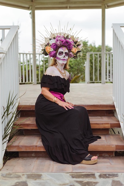 Woman made up as catrina. Mexican woman made up as catrina for day of the dead celebration. Rural scenery.