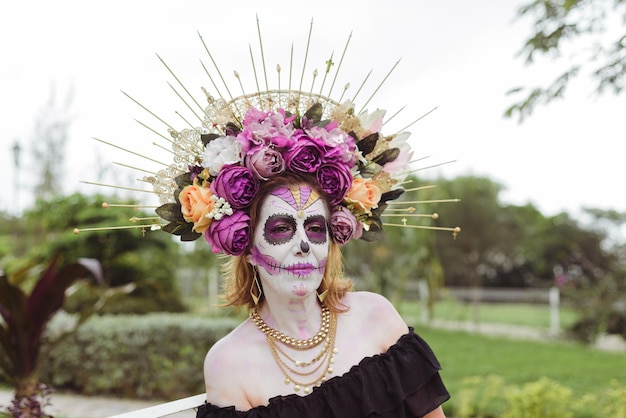 Woman made up as catrina. Mexican woman made up as catrina for day of the dead celebration. Rural scenery.