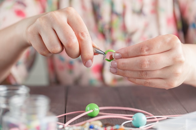 Woman make handmade jewellery