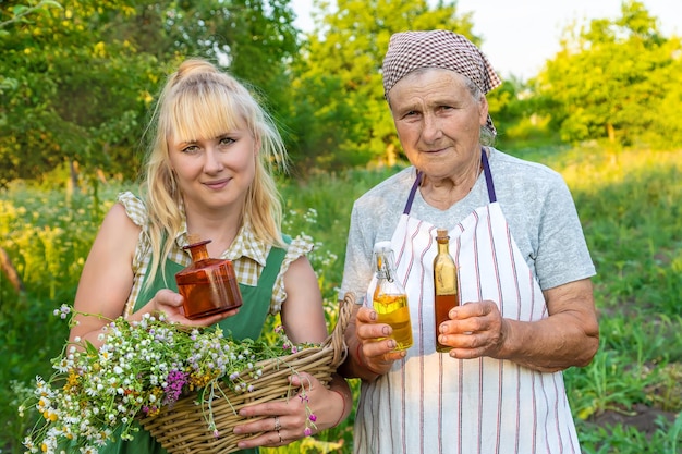 A woman makes herbal tincture Selective focus