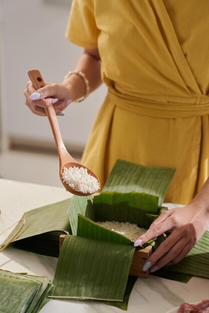 Woman Making Banh Tet Cake