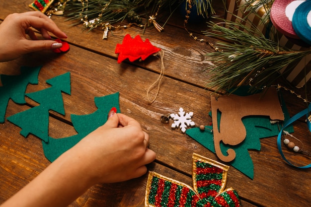  Woman making Christmas or New Year decor 