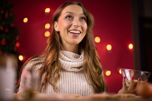 Woman making gingerbread cookies