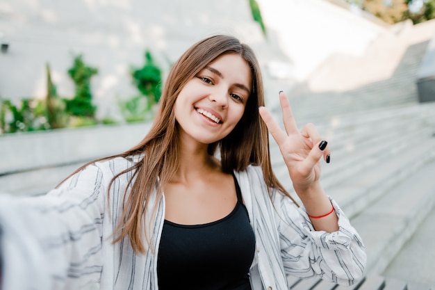 Woman making selfie