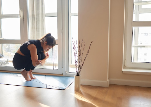 Woman making yoga pose whit legs up