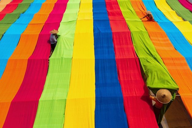 Woman manipulating handcrafted colorful lotus fabrics