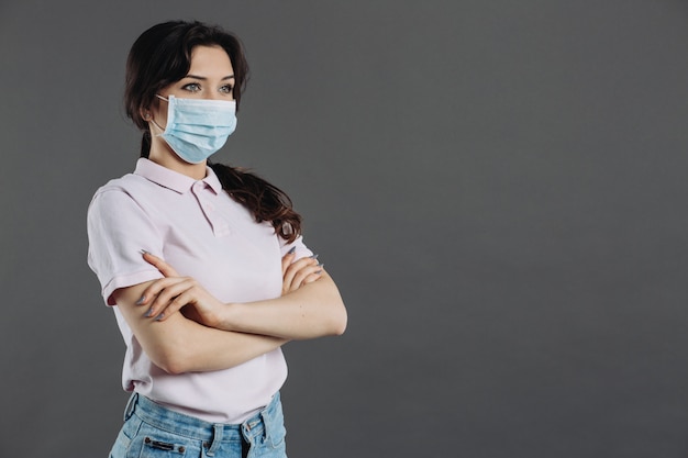 Woman in medical mask protecting from coronavirus. Home insulation and quarantine.