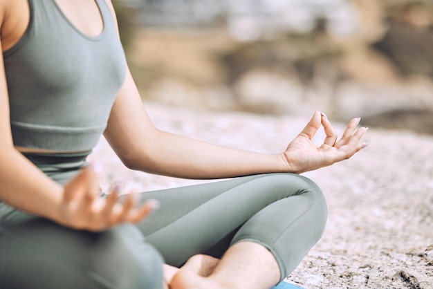 Woman mudra hands and beach meditation for mental health chakra balance or mind wellness Zoom zen or calm yogi in lotus pose peace or holistic energy mindset training in nature earth environment