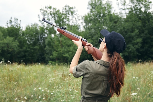 Woman on nature Hunting lifestyle aim up green leaves