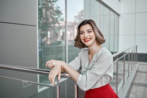 Woman near building outdoors posing smile lifestyle