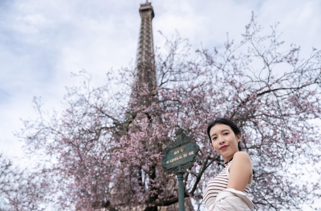 Woman near the Eiffel tower Paris France