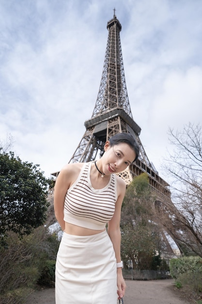 Woman near the Eiffel tower Paris France