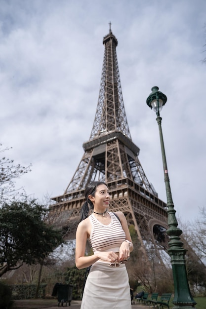 Woman near the Eiffel tower Paris France