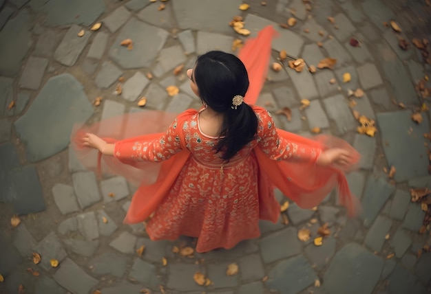 a woman in an orange dress is standing on a stone floor with gold coins