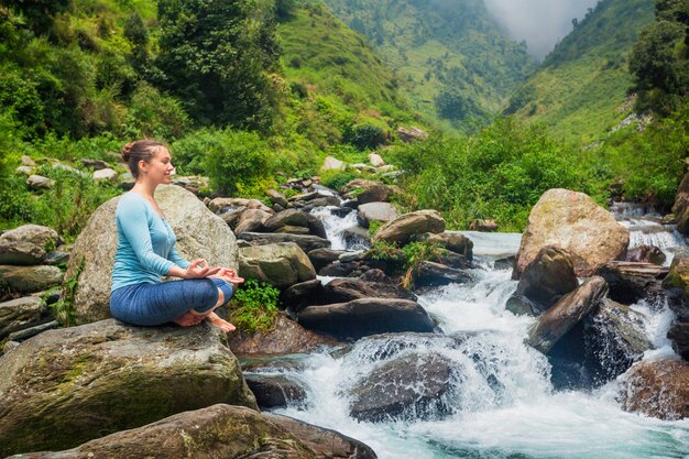 Woman in Padmasana outdoors