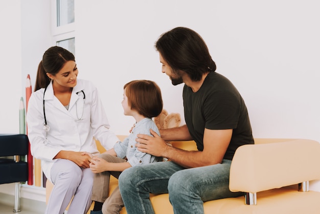 Woman Pediatrician Greets Kid in Clinic Handshake