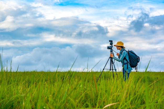 Woman photographer take photo on hills nature