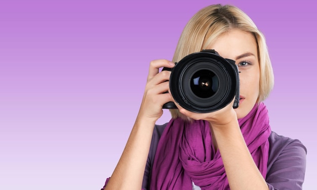 Woman photographer with camera, isolated on white