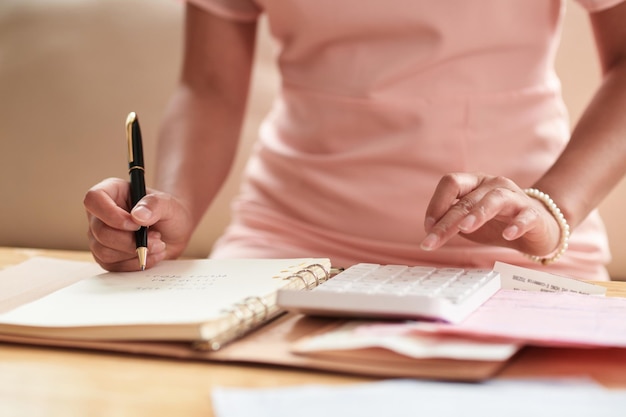 Woman planning her finance at table