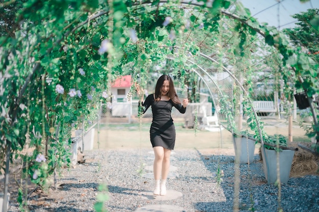 Woman playing fun happy flower tunnel