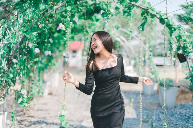 Woman playing fun happy flower tunnel