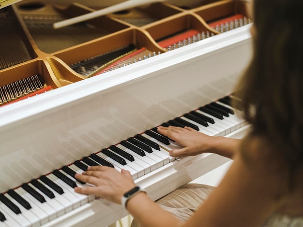 A woman playing the piano