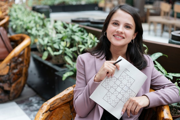 Woman playing a sudoku game alone