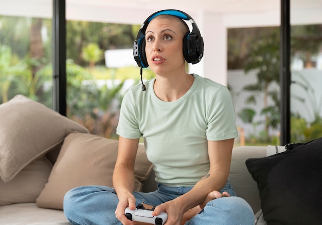 Woman playing a video game with her console