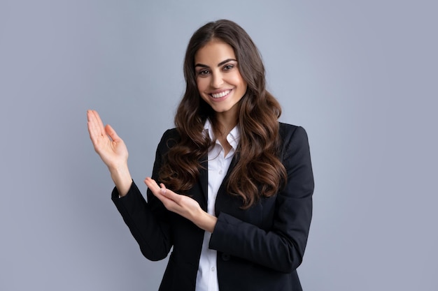 Woman point at copy space showing copyspace pointing Promo girl showing advertisement content gesture pointing with hand recommend product Isolated background Positive thinking