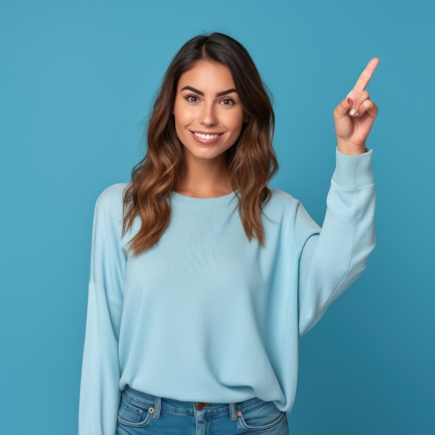 a woman pointing to the right with a blue background