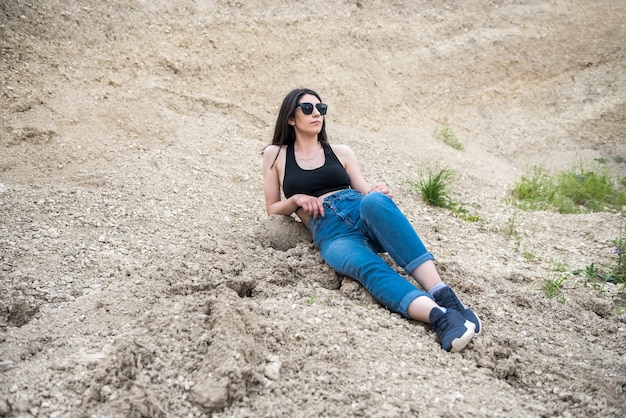 Woman portrait enjoy summer time on the sand quarry, trip or vacation