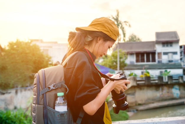 Woman portrait, Thai woman tourists like photography, love to travel, Travel on trip in holiday Watch the sunrise and morning mist in Yala Province, Southern Thailand, Asia.