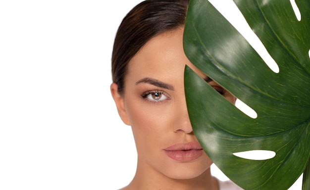 woman portrait with leaf on white background