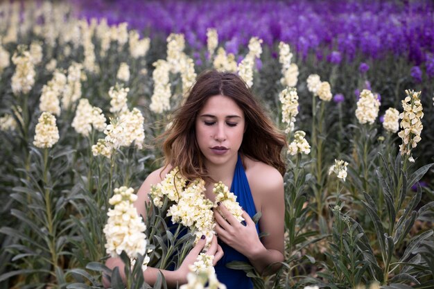 Woman posing in flower field