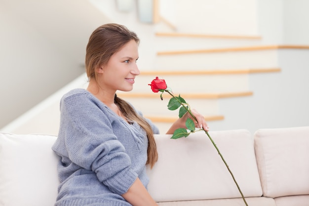 Woman posing with a rose