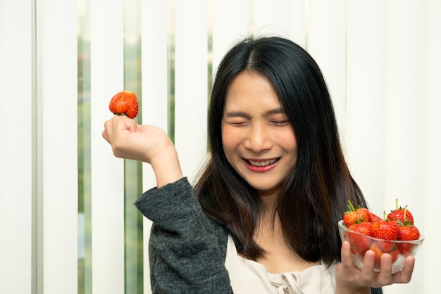 Woman posing with strawberries