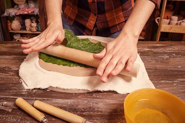 Woman potter sculpts clay