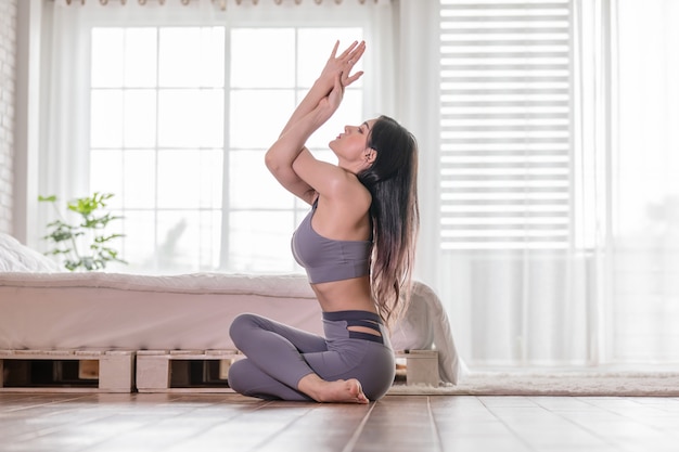 woman practices yoga position