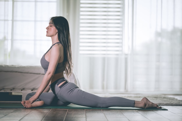 woman practices yoga position