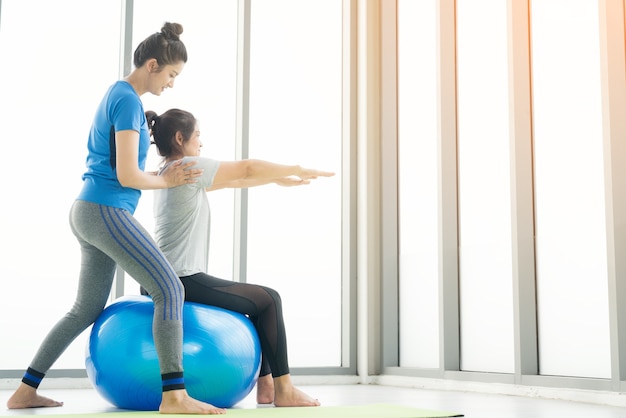 Woman practicing yoga working out, wearing sportswear, Calmness and relax, female happiness.