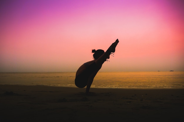 woman practicing yoga  