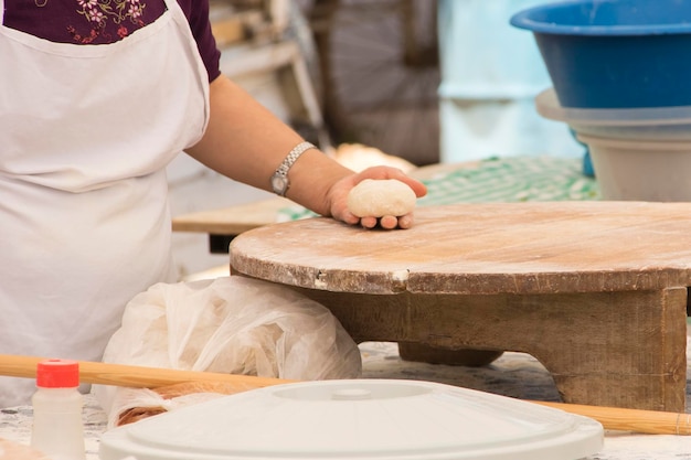 A woman prepares traditional Turkish pastries gozleme