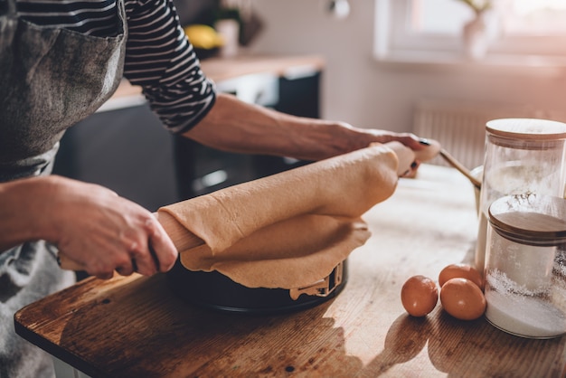 Woman preparing pie crust dough