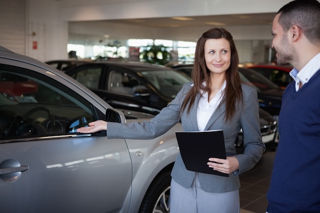 Woman presenting something to a man