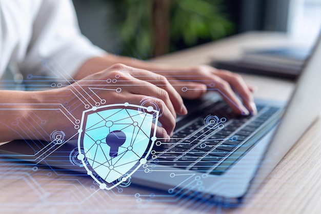 A woman programmer is typing a code on computer to protect a cyber security from hacker attacks and save clients confidential data Padlock Hologram icons over the typing hands Formal wear